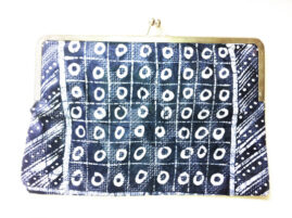 clutch with gold and an abstract black and white pattern