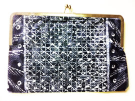 clutch with gold and an abstract black and white pattern