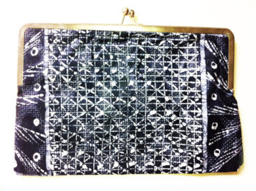 clutch with gold and an abstract black and white pattern