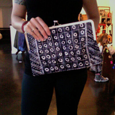 clutch with gold and an abstract black and white pattern