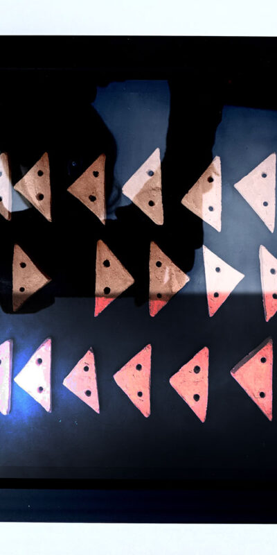 Follow>plan>journey Abstract textile print with pink triangle on blue background