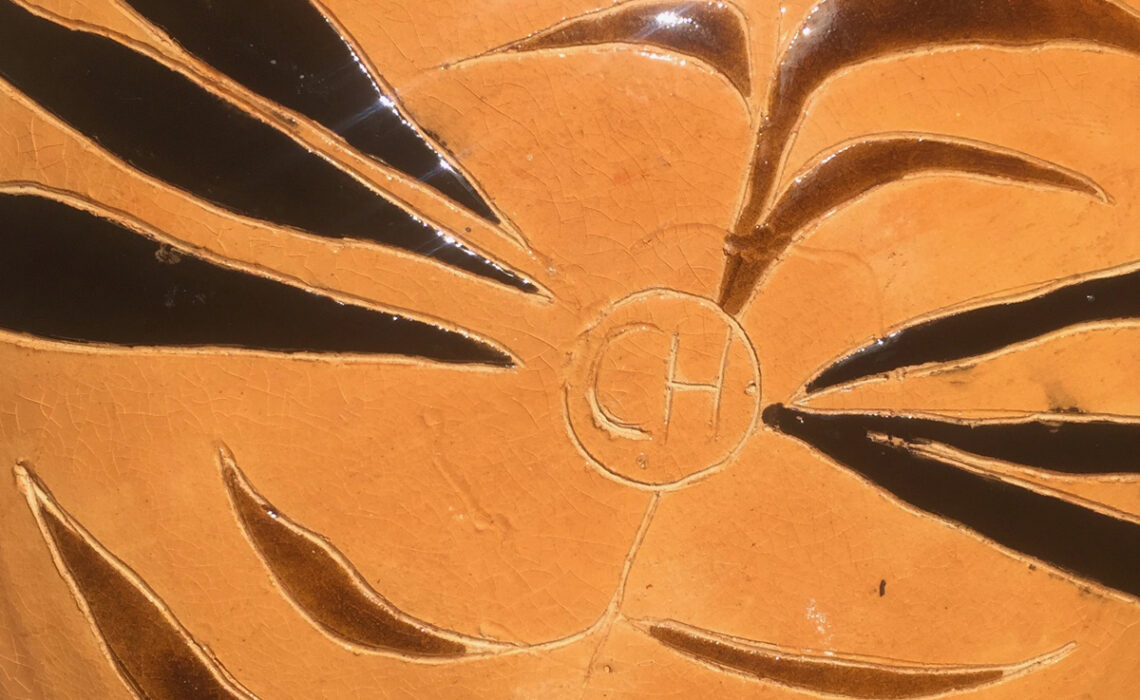 Ceramic bowl in african style with brown and black stripes